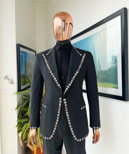 A steel black, seer sucker fabric, knitted, peak lapel suit