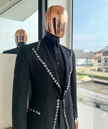 A steel black, seer sucker fabric, knitted, peak lapel suit