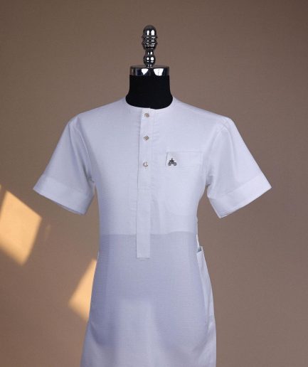 A bright white, tiny square pattern, front flap with gold Swarovski button, 3/4 sleeve African kaftan.