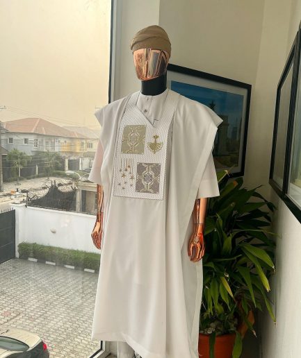 A white, dripping stars and interconnected maze embroidery details agbada