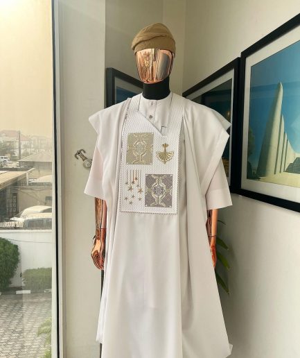 A white, dripping stars and interconnected maze embroidery details agbada
