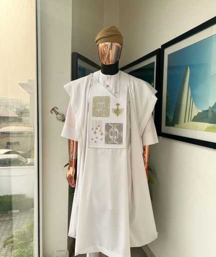 A white, dripping stars and interconnected maze embroidery details agbada