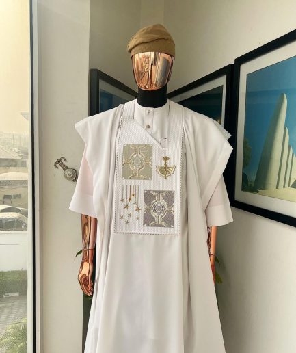 A white, dripping stars and interconnected maze embroidery details agbada