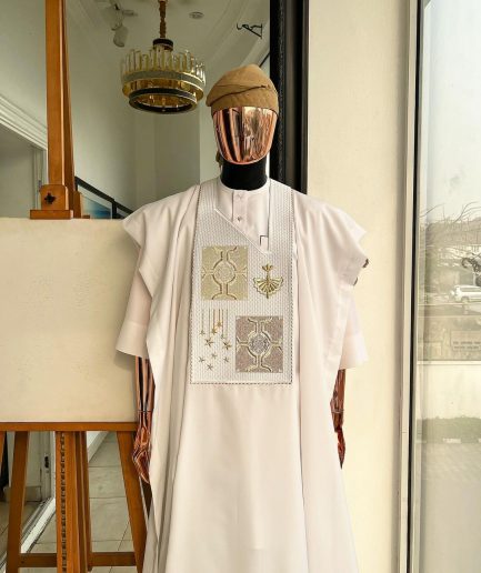 A white, dripping stars and interconnected maze embroidery details agbada