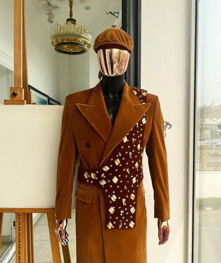 A Caramel brown, soaked velvet, peak lapel double breasted trench suit