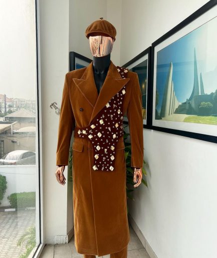 A Caramel brown, soaked velvet, peak lapel double breasted trench suit