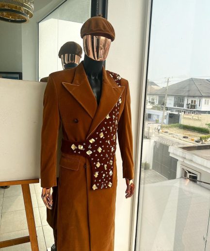 A Caramel brown, soaked velvet, peak lapel double breasted trench suit