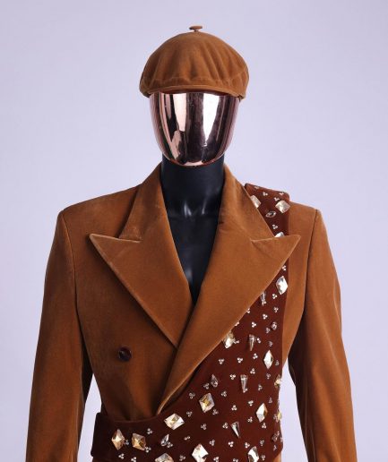 A Caramel brown, soaked velvet, peak lapel double breasted trench suit