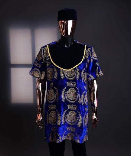 An “isiagu” gold, blue with matching fringe details, short sleeve, hat and velvet pant African traditional native.