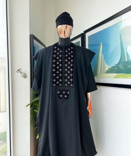 A charcoal black, grommet eyelet on dropping octa with silver Swarovski embroidery details agbada
