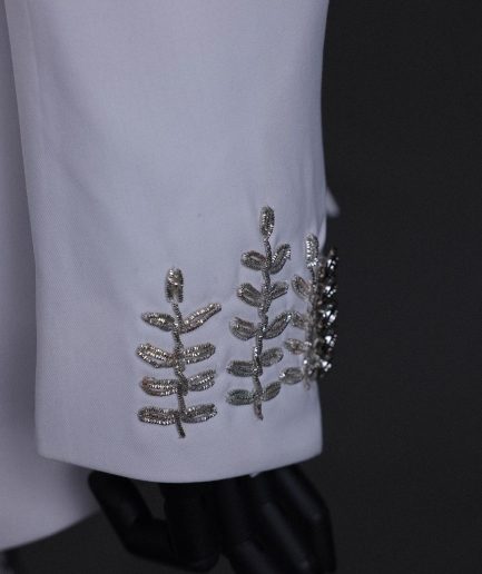 A white, hand “ide” silver metal wire embroidery, right hand sache safari suit
