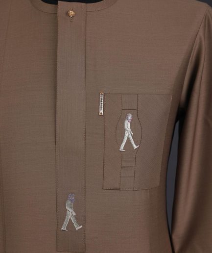 A Peanut brown, front flap, walking paul embroidery details, 3/4 sleeve African senator kaftan native.