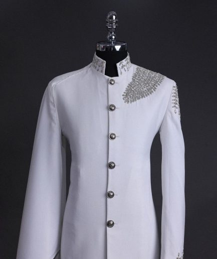 A white, hand “ide” silver metal wire embroidery, right hand sache safari suit