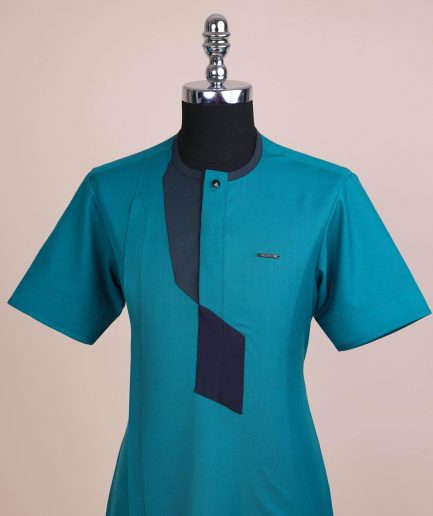 A Castleton green, front flap, patterned flap with black Swarovski button, short sleeve African senator kaftan native.