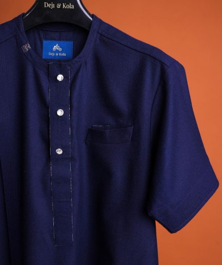 A Navy blue, 120s jorgecarli wool, front flap, short sleeve with clear view Swarovski button details African traditional senator kaftan native.