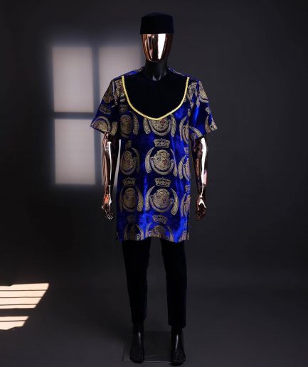 An “isiagu” gold, blue with matching fringe details, short sleeve, hat and velvet pant African traditional native.