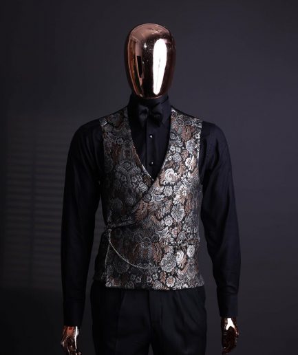 A knitted, brown, silver and black floral jacquard peak lapel suit