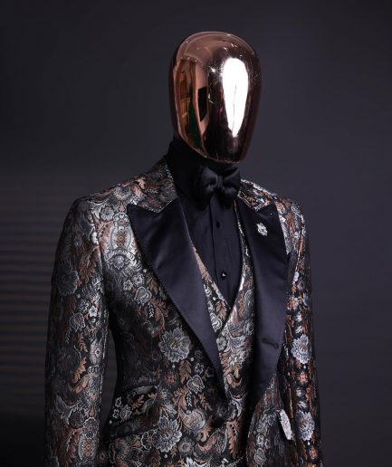 A knitted, brown, silver and black floral jacquard peak lapel suit
