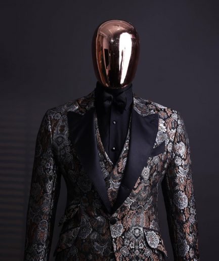A knitted, brown, silver and black floral jacquard peak lapel suit