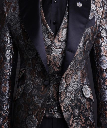 A knitted, brown, silver and black floral jacquard peak lapel suit