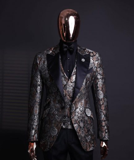 A knitted, brown, silver and black floral jacquard peak lapel suit
