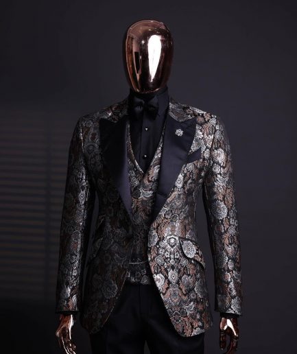 A knitted, brown, silver and black floral jacquard peak lapel suit