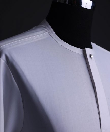 A White, front flap,interwoven buckle, Long sleeve African senator kaftan native.