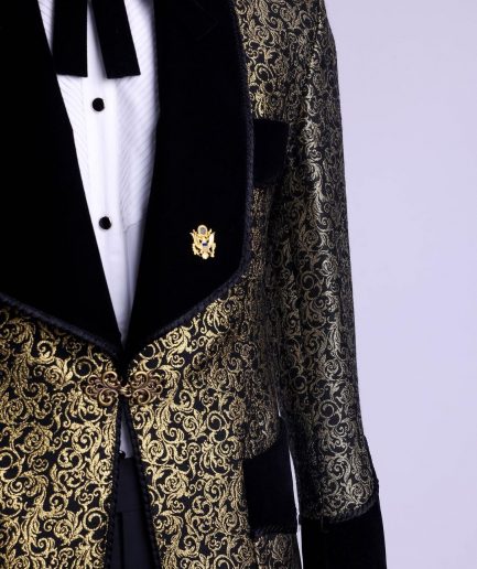 A Gold and black patterned metallic Jacquard tuxedo suit with sharaba wooven edge detailing