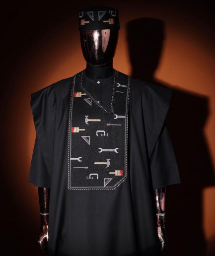 A Charcoal Black, “ise ni ogun ise” - work is the antidote of poverty - pattern embroidery details agbada, 3/4 sleeve kaftan & sokoto