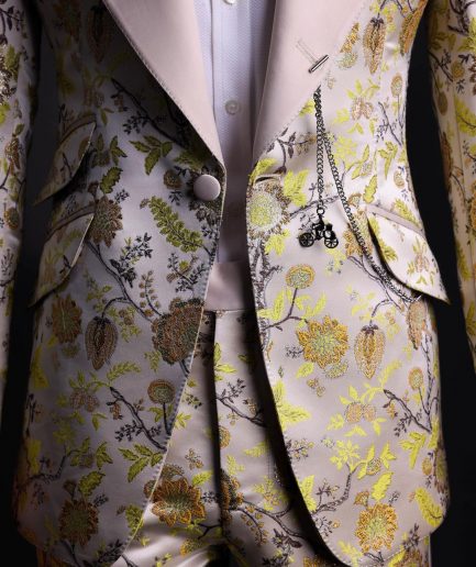 A Floral splashed yellow, mocha and cedar brown, knitted, peak lapel tuxedo suit