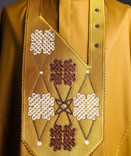 A tawny brown, “connected arewa ” embroidery details with laced Swarovski stone agbada