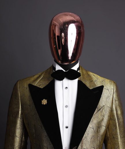 A gold metallic jacquard peak lapel tuxedo suit