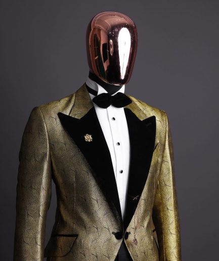 A gold metallic jacquard peak lapel tuxedo suit