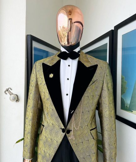 A gold metallic jacquard peak lapel tuxedo suit