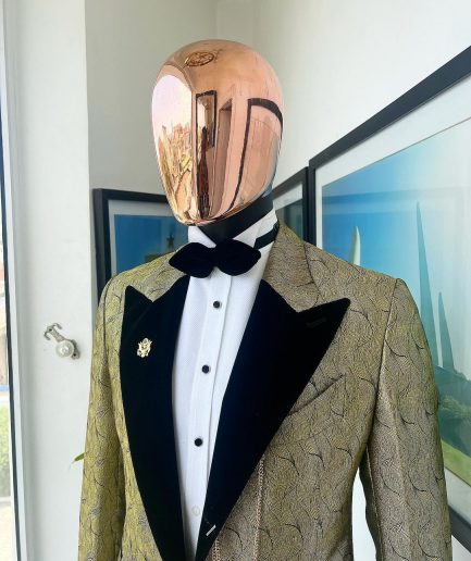 A gold metallic jacquard peak lapel tuxedo suit