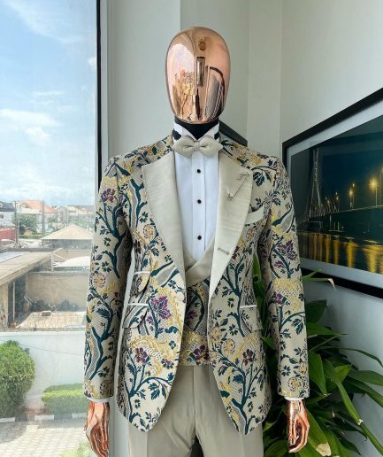 A Tortilla brown, emerald green, gold and splash of burgundy metallic floral jacquard peak lapel tuxedo suit