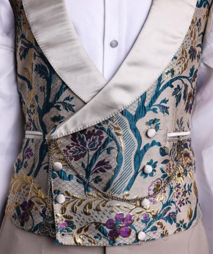 A Tortilla brown, emerald green, gold and splash of burgundy metallic floral jacquard peak lapel tuxedo suit