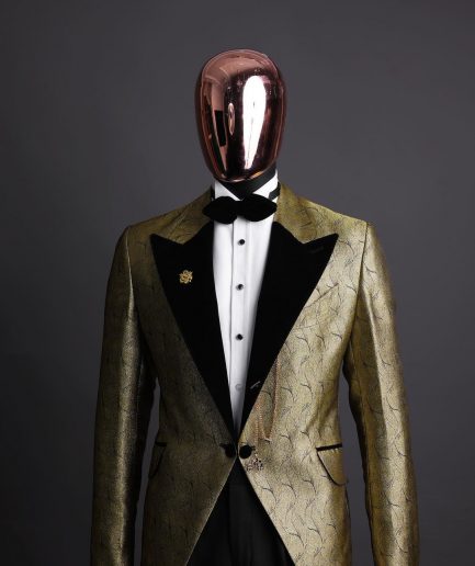 A gold metallic jacquard peak lapel tuxedo suit