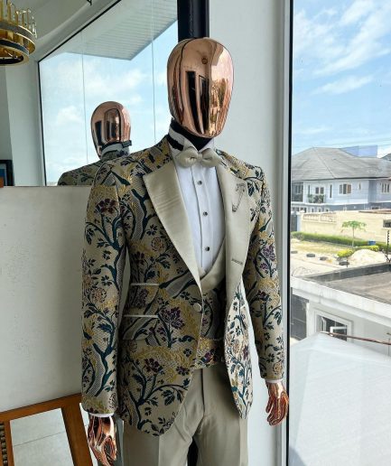 A Tortilla brown, emerald green, gold and splash of burgundy metallic floral jacquard peak lapel tuxedo suit
