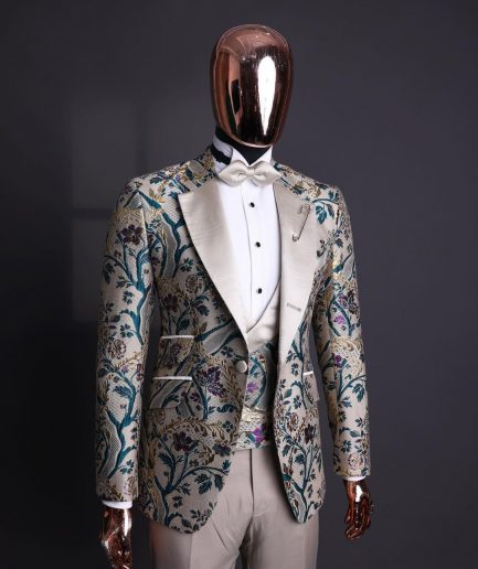 A Tortilla brown, emerald green, gold and splash of burgundy metallic floral jacquard peak lapel tuxedo suit