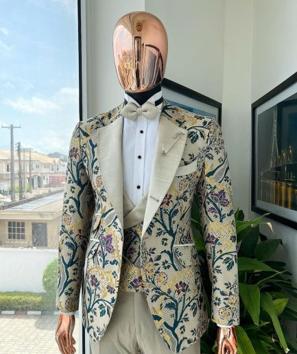 A Tortilla brown, emerald green, gold and splash of burgundy metallic floral jacquard peak lapel tuxedo suit