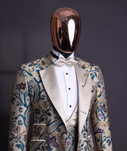 A Tortilla brown, emerald green, gold and splash of burgundy metallic floral jacquard peak lapel tuxedo suit