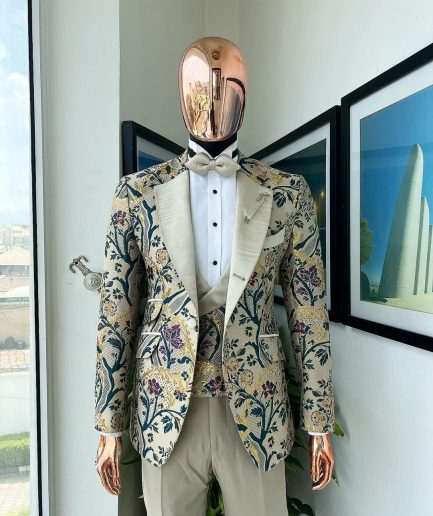 A Tortilla brown, emerald green, gold and splash of burgundy metallic floral jacquard peak lapel tuxedo suit