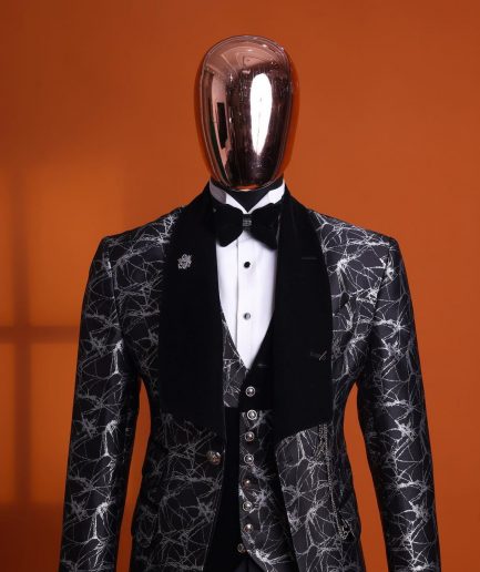 A charcoal black and silver spiral jacquard, shawl lapel tuxedo suit