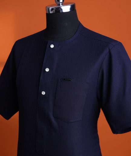 A Jorgecarli wool, midnight blue, invisible windowpane check, front flap with silver Swarovski button, shorts sleeve African senator kaftan native.