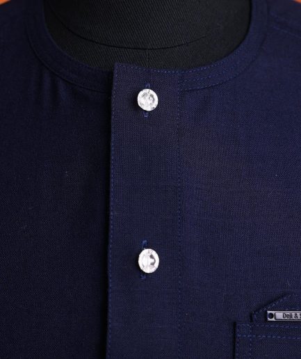 A Jorgecarli wool, midnight blue, invisible windowpane check, front flap with silver Swarovski button, shorts sleeve African senator kaftan native.