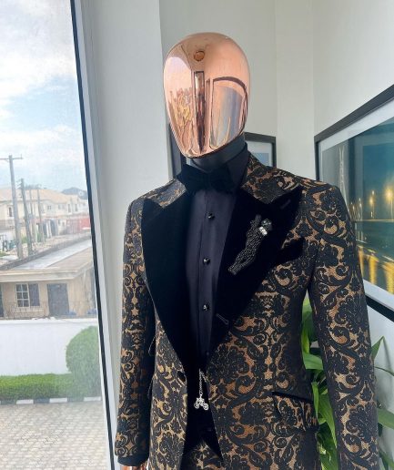 A Gold and black mandarin metallic floral jacquard, peak lapel tuxedo suit.