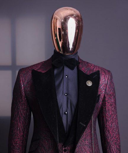 A burgundy, black broom splashed metallic jacquard, knitted, peak lapel tuxedo suit