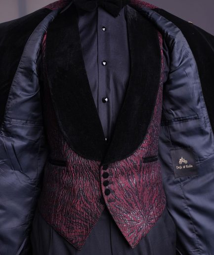 A burgundy, black broom splashed metallic jacquard, knitted, peak lapel tuxedo suit