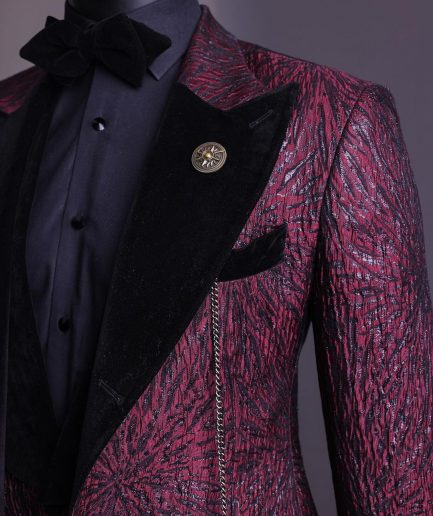 A burgundy, black broom splashed metallic jacquard, knitted, peak lapel tuxedo suit